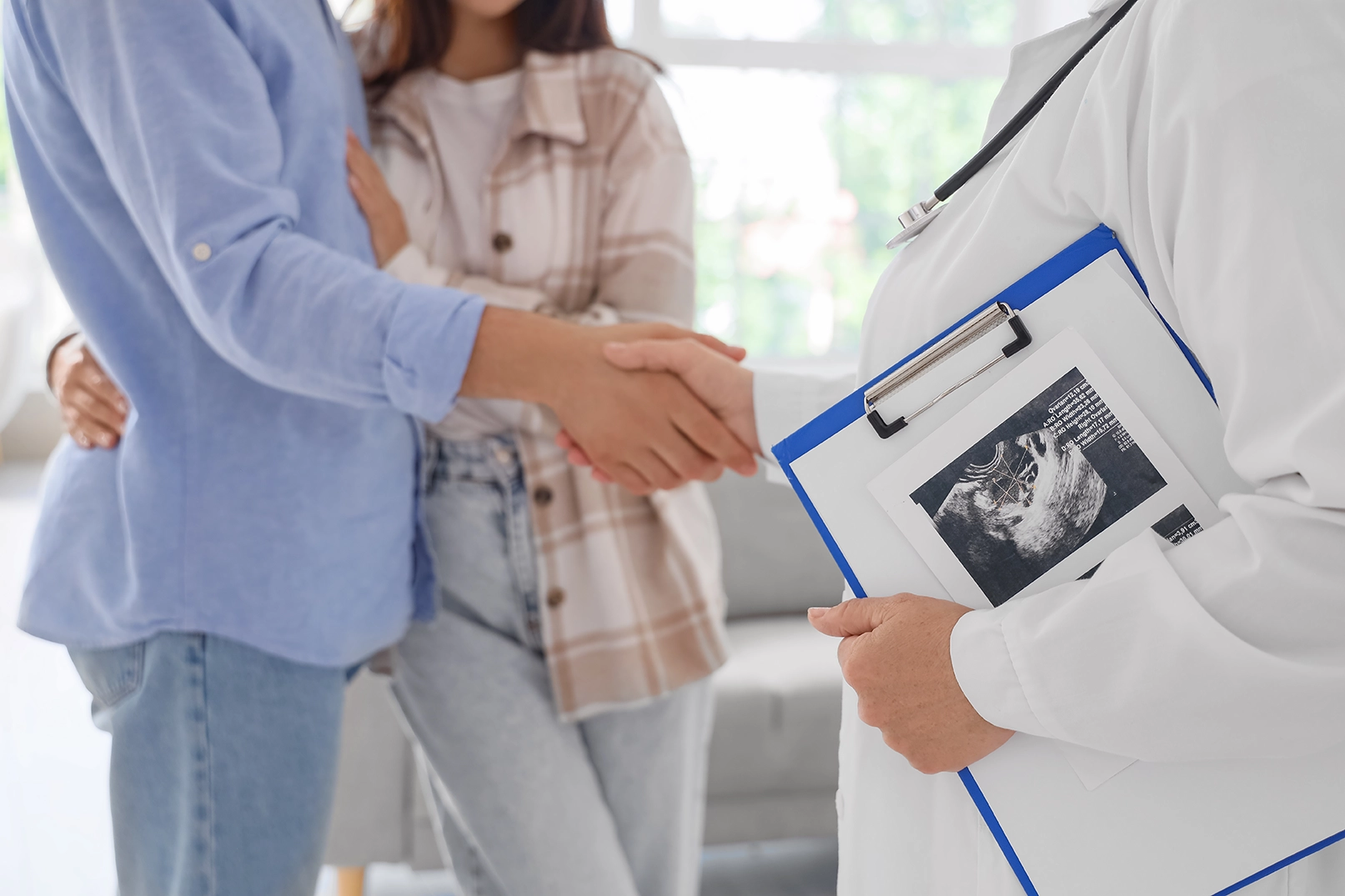A couple being congratulated after a successful conception journey